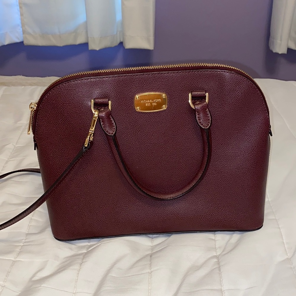 Maroon Michael Kors purse.